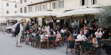 Busy tables outside an Italian bar in Pietrasanta