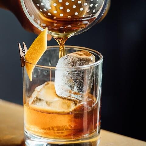An Old Fashioned being poured